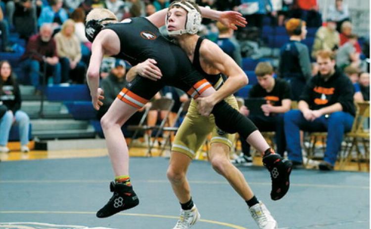 Collin Longtin in action at the wrestling tournament in Walhalla went on to pin his opponent on Feb. 7. Photo by Larry Stokke