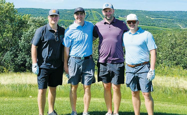 The winning team of Frost Fire's second annual golf tournament fundraiser (L-R) Andy Norman, Ross Johnson, Blaine Johnson, and Casey Fugleberg. Photo by Julie Regner.