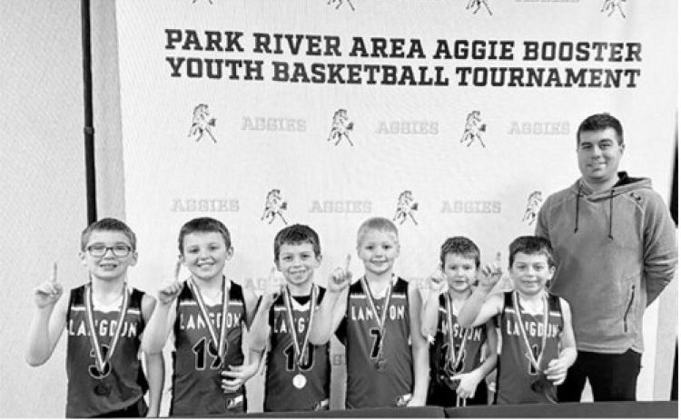 Langdon first grade boys did well at the Park River Area Aggie Booster Youth Basketball Tournament on Jan. 24, winning the second grade division of the 3-on-3 tournament. Pictured L-R Laetyn Schaefer, Ben Schaefer, Emmit Roy, Lane Moline, Jensen Flink, Ivan Roy, and Coach Anthony Roy. Submitted photo
