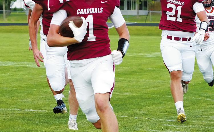 Eastyn Schaefer runs the ball down the sideline. Photo by Larry Stokke.