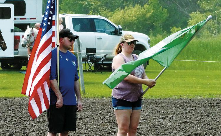 Flag carriers for the opening of the show were (left) Lt. Colonel Dustin Helsel, Director of Staff for the 69th Bomb Squadron at Minot Air Force Base and (right) Major Lauren Lauritzen, Director of Operations for the 10th Space Warning Squadron at Cavalier Space Force Station. Photo by Larry Stokke.