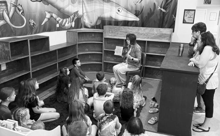 Joan Chaput read ‘A Coat of Many Colors’ and ‘Phiona the Flamingo’ to the kids for Story Hour.