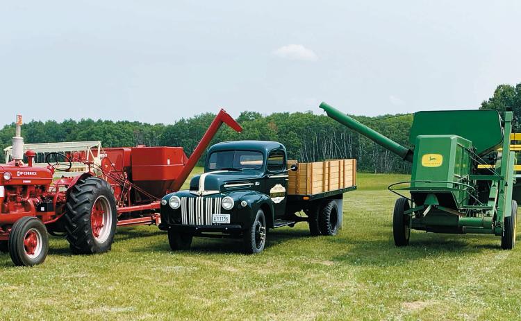 Combines and trucks are parked and ready for the 31st Annual Pioneer Machinery Show taking place Sept. 8 at the Pembina County Museum Grounds. Submitted photo.