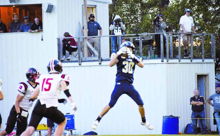 Brody Berg leaps to make a catch at the Eagles homecoming game last Saturday. Photo by Rebecca Davis.