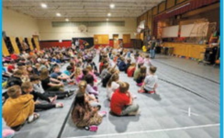 Students gather to learn about being a snowplow driver and get safety tips. Submitted photo.