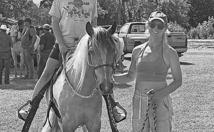Amelia and Hilary posing with Sassy.