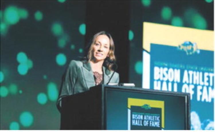 Langdon native Katie Lorenz Johnson speaks during her induction into the North Dakota State University Bison Athletic Hall of Fame on Oct. 2. Johnson, the 2001 North Dakota Miss Basketball recipient, went on to a standout career with the Bison. Submitted photo