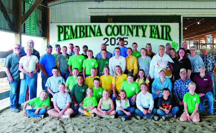 4H kids and the sponsors who bid on their animals that they raised. Photo by Larry Stokke.