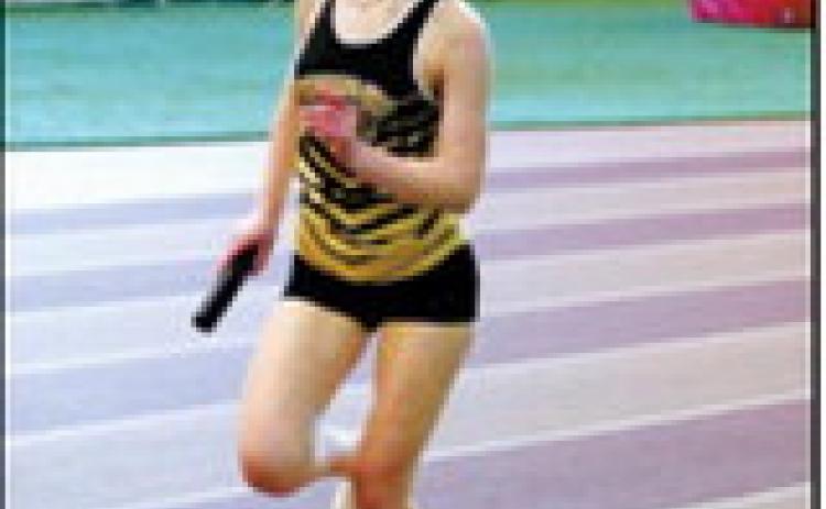Eliot Peterson, along with teammates Gracelynn Moe, Brystol Homstad and Emma Seng, placed seventh in the 4x300 relay. Photo by Larry Stokke.