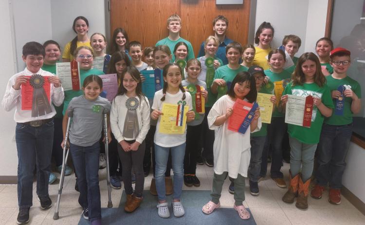 First row (L-R) Brinxlee Hay, Olive Truver, Elana Stegman, Aika Osowoski; second row: Colt Cruea, Melody Hubbard, Lainy Shane, Olivia Olimb, Mallory Latozke, Sadie Kennedy, Oscar Hunter, Silas Norrell, Adlee Hay, Penelope Johnson, Levi Norrell; third row: Pyper Shane, Nathan Stegman, George Alfred Truver, Chloe Hunter, Stella Norrell, Isla Emerson, Gary Olimb, Aurora Vernon; fourth row: Caroline Stegman, Audrey Emerson, Chaz Halverson, Preston Emerson, and Naomi Stegman.