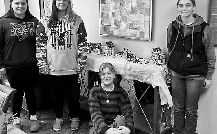 Georgia, Jaelyn, Gracyn, and Jenny take a break from their hard work to snap a photo.