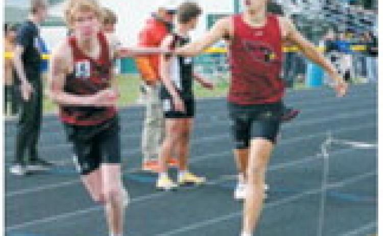 Performers of the meet, brothers Tanner and Caleb McDonald helping the Cardinals to a first place finish in the 4x400 relay. Braxton Lindseth and Gavin Trottier were also members of the relay team. Photo by Larry Stokke