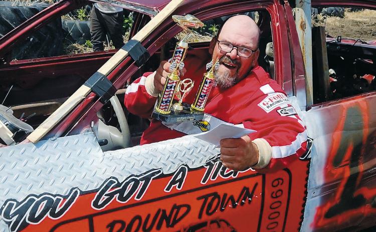 Brian Laporte poses for a photo after winning the compact class in his #11 car. Photo by Jessica Reidhammer.