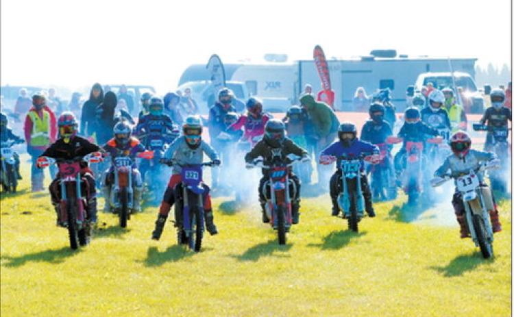 Riders charge from the starting line during the 20th annual Peterson Coulee Hare Scramble, held Sept. 12-13. Photo by Larry Stokke