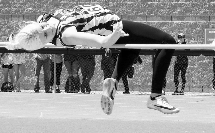 Megan Mission placed 7th in high jump at the State Track Meet. Photo by Larry Stokke.
