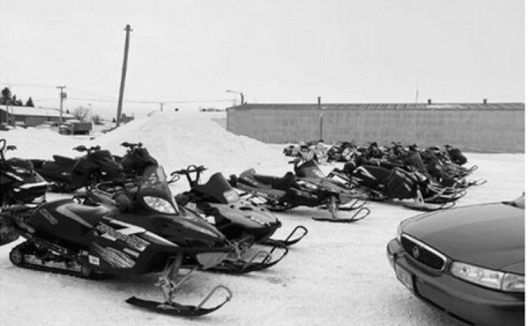 Snowmobiles are lined up outside At the Hop in Langdon during the 2025 Fun Run. Submitted photo