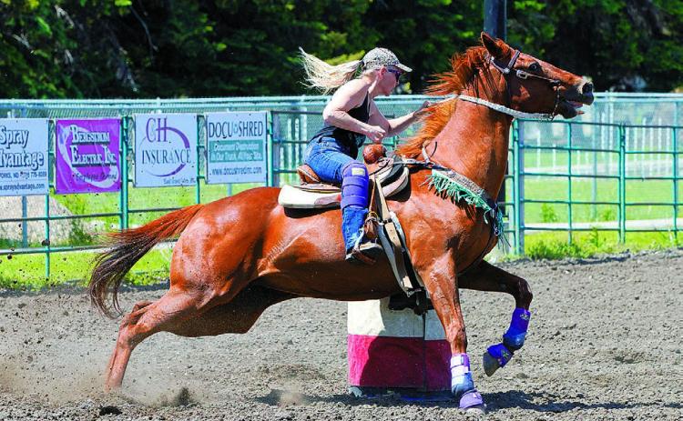 Cyndi Hummel and her mare, BLR Balto, placed 4th in the 2D Division in Grand Forks on June 8. Hummel is a mother of two and grandmother of one. She resides in Mountain, N.D. Photo by Larry Stokke.