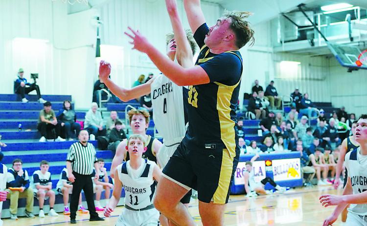 Kade Schafer drains a layup in the lane during the Eagles' win over the Cougars in Rolla on Jan. 7. Photo by Larry Stokke.