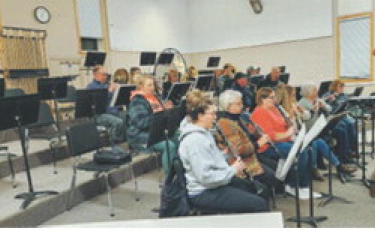 Members of the Langdon Community Band rehearse in the Langdon Area High School band room. Submitted photo