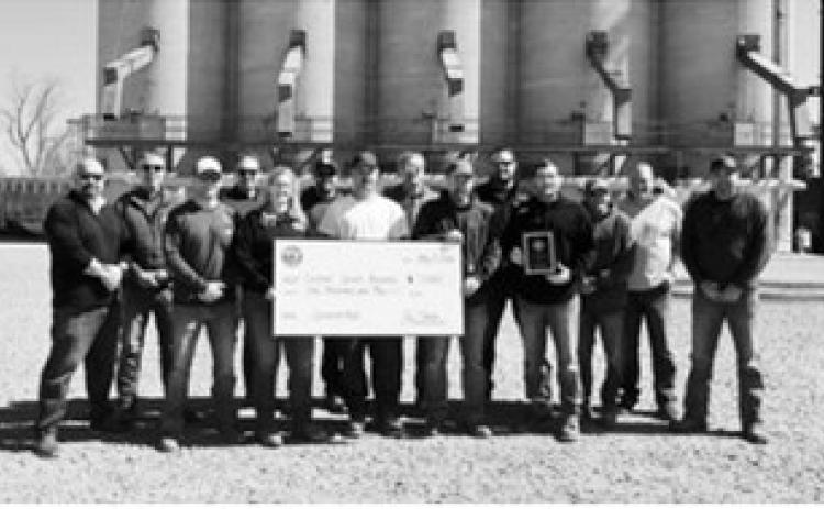 Pictured, from left, are Northern Plains Railroad representatives Ben Liden, Ryan Riskey, Derek Muir, Ben Chalich, Jessica Tennison and Jody Wilson; and North Prairie Ag Nekoma team members Chris Lee, Robbie Lorenz, Clint Arens, Paul Medbery, Josh Schaefer, Jeff Orminston, Chris Schaefer and Josh Overby, representing the Cardinal Sports Boosters.