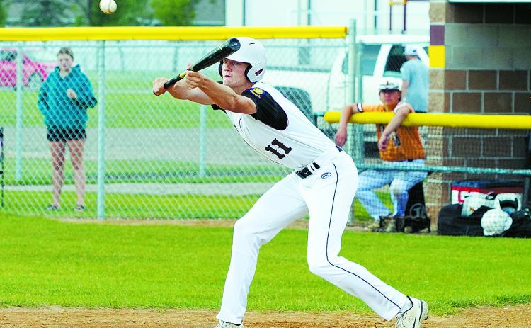 Cody Amble bunts the ball to advance a teammate. Photo by Larry Stokke.
