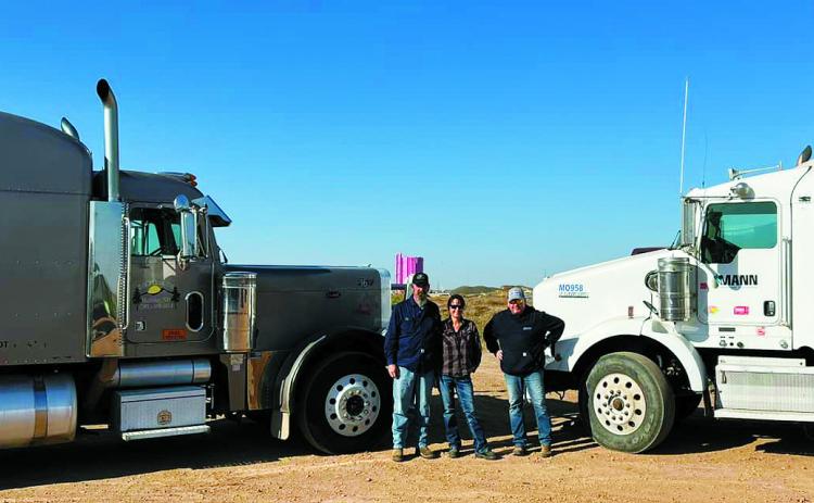 Freddie and Shauna Gentry (left) along with Garrett Romelle with trucks from S&amp;F Trucking and Mann Energy used to gather relief supplies donated from across North Dakota. Freddie and Shauna left North Dakota bound for North Carolina on Oct. 21. Contributed by Shauna Gentry.