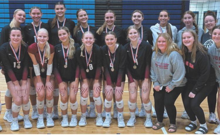 The Langdon Area-Munich Cardinals display their first-place medals after winning the Valley City volleyball tournament Sept. 19.