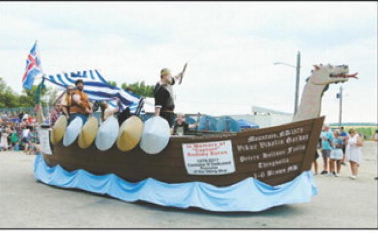 A Viking ship float honoring the late “Captain” Rodney Byron makes its way through Mountain during the Deuce of August parade. Photo by Larry Stokke