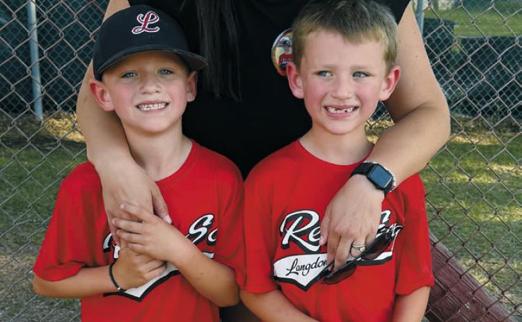 Shannon Bjornstad poses with her twin sons, Gus and Berit, at the Langdon baseball diamonds. Bjornstad is helping lead efforts to raise funds for an automated external defibrillator (AED) at the baseball field following a recent medical emergency. Submitted photo