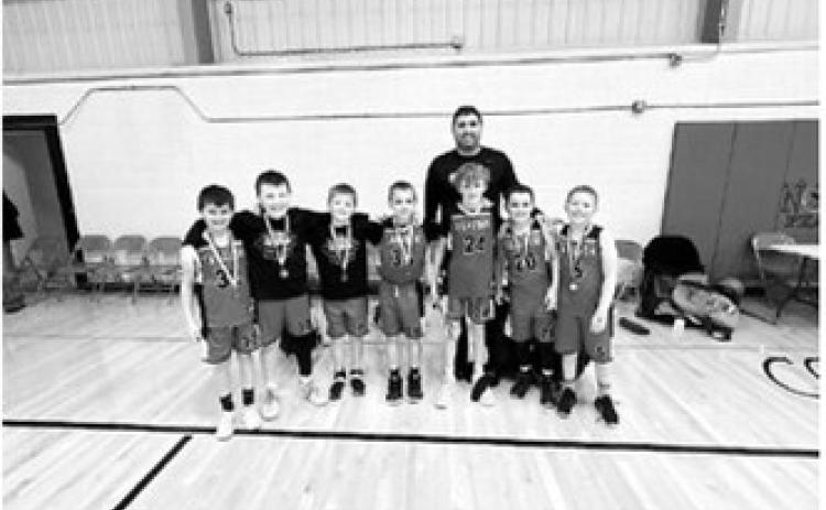 The fourth-grade boys took first place in the Langdon Dakota Frost Tournament. L-R: Cash Feil, Jaxtin Overby, Calvin Moline, Brexten Bjornstad, Henry Lorenz, Jack Schaefer, Myles Martin Coach Justin Overby Submitted photo