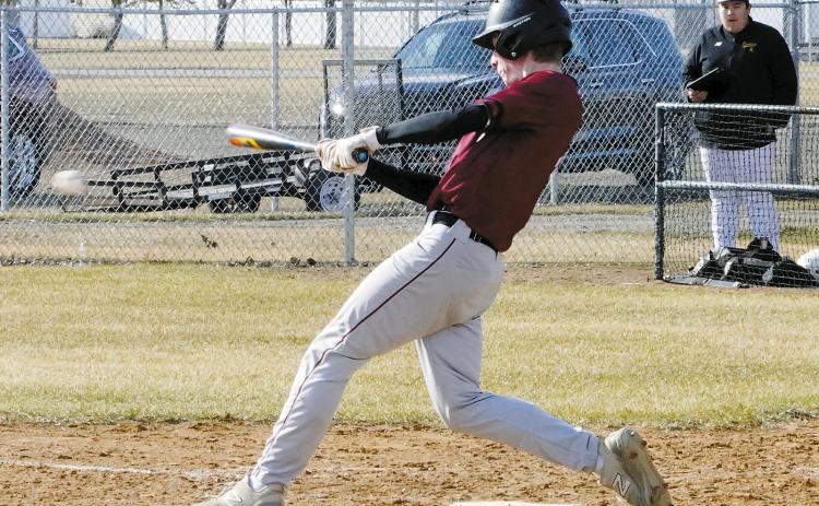 Eastyn Schaefer connects for a base hit against the Grafton Spoilers. Photo by Larry Stokke.