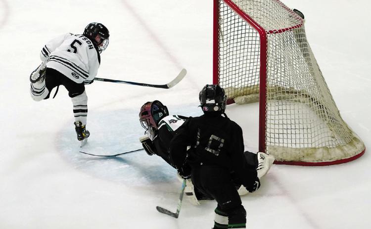 Cooper Fetsch scores on the Prowls to add to the Blades' 9-4 win over the JVC Prowl in Langdon on Nov. 29. Photo by Larry Stokke.