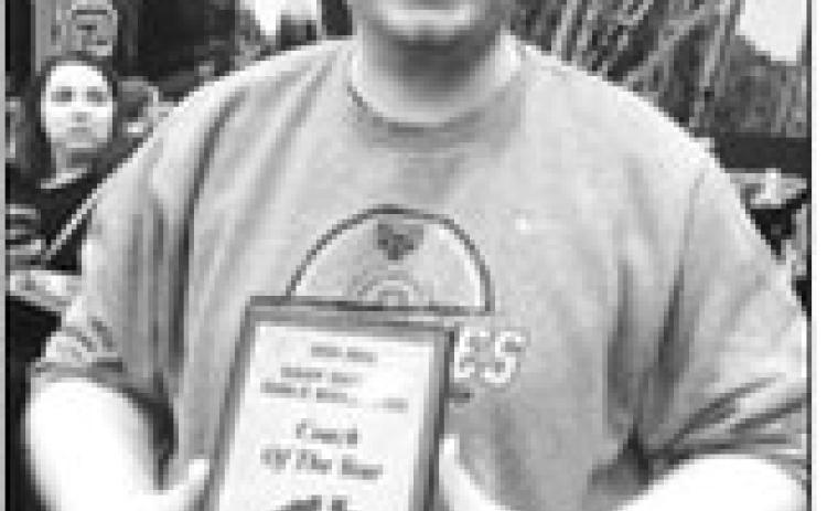 Pictured is Pembina County North head girls wrestling coach Crag Brodeur, receiving the 2026 East Region Girls Wrestling Coach of the Year award. Brodeur guided the Grizzly girls to the top seed in the East Region Dual Tournament, where they finished fourth. Crag is now up for the State Girls Wrestling Coach of the Year award. Congrats Coach Brodeur!