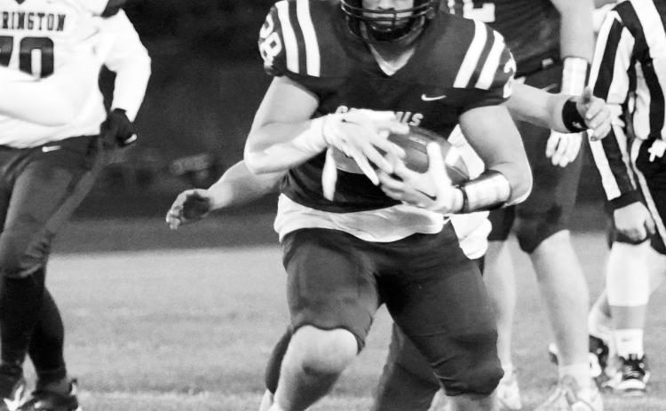 Theo Romfo runs for a first down in the Cards home game against Carrington on Oct. 4 in Langdon. Photo by Larry Stokke.