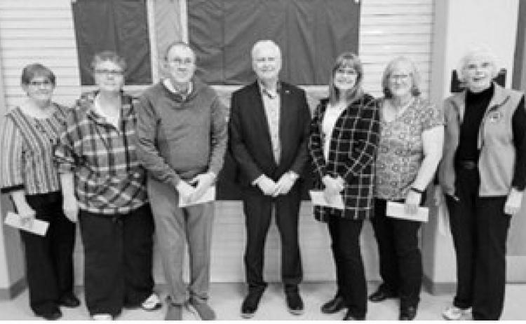 Accepting the grants from Curtis Olafson, president of the ICA, left to right, are Karen Kristjanson for the Thingvalla Cemetery Association, Michelle Murray for Svold Community Hall, Gerald Christianson for Borg Pioneer Memorial Home, Curtis Olafson - president of the ICA, Sharon Laxdal for the Gardar Town Lutheran Church, Karen Langerud for the Gardar Township Hall, and Carol Beard for Akra Hall at Icelandic State Park.