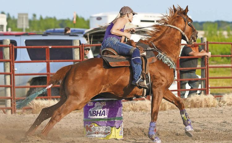 Cyndi Hummel on BLR Balto round the second barrel in Devils Lake on June 24.