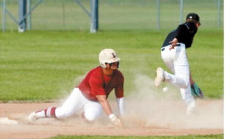 Theo Romfo slides safely into second base during Langdon's win over Midway-Minto on July 14. Photo by Larry Stokke