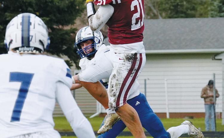 Theo Romfo leaps high and makes a great reception in the Cards' win over Hillsboro. Photo by Larry Stokke.