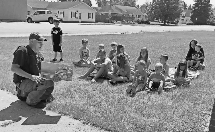 Jeff Sims reads to children as part of the Summer Reading Program at Walhalla Public Library.